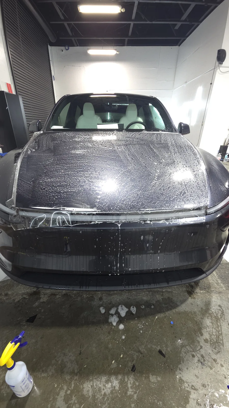 Film going onto a hood, slip solution still on the panel