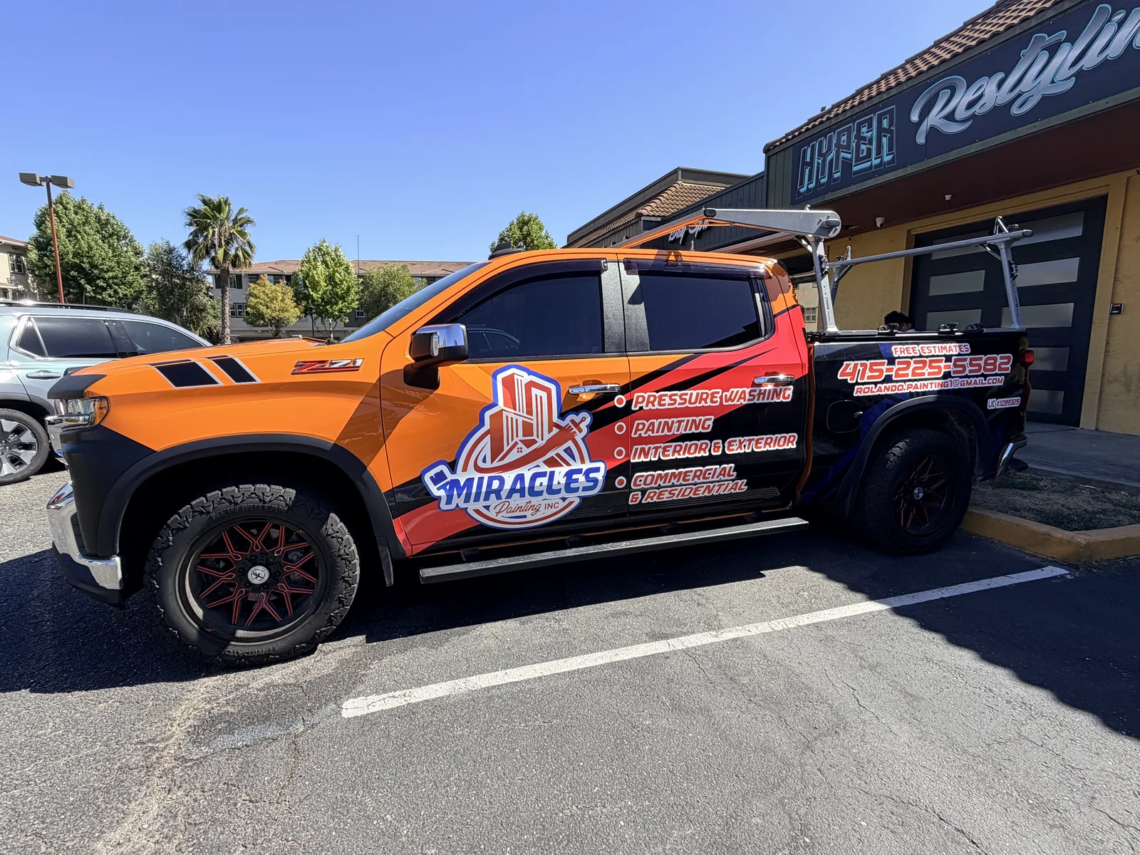Miracles Painting truck, full print wrap, parked out front when it was done